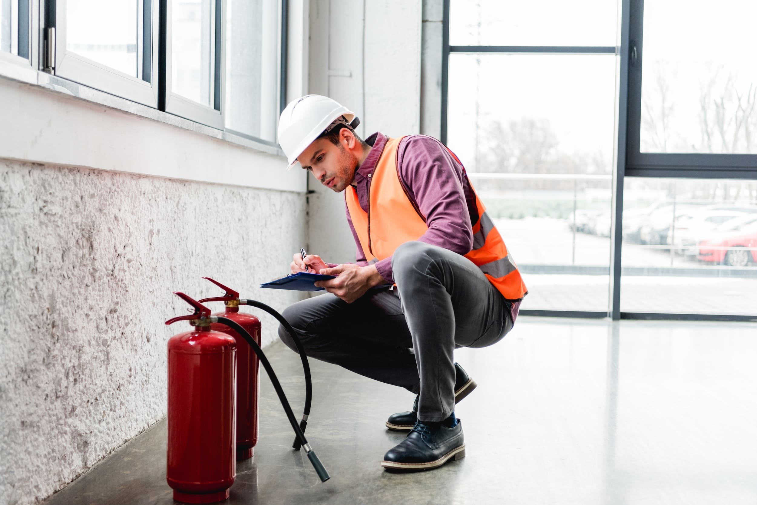 handsome-fireman-in-helmet-sitting-near-extinguish-2026-01-06-00-26-44-utc